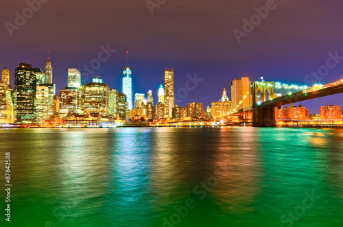 Manhattan skyline and Brooklyn Bridge at night. © Javen