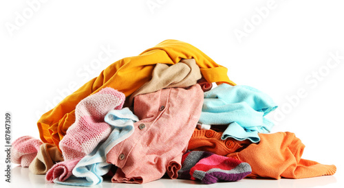 Heap of different clothes, isolated on white