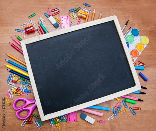 school supplies and blackboard