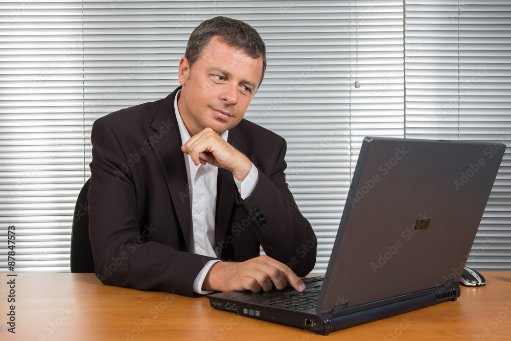 Business man at work at his office Business man at work at his office