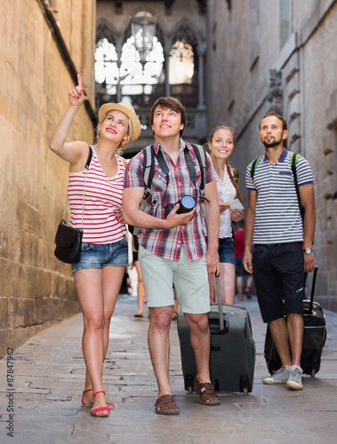 European travelers walking at the street