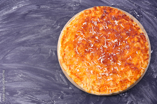 Cheese pizza on wooden table, closeup