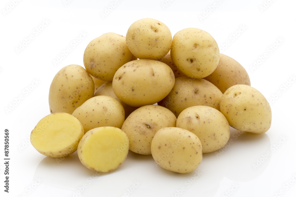 Potatoes on the white background. New harvest. Potatoes on the white background. New harvest.