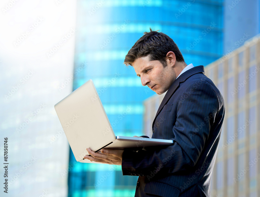 young businessman holding computer laptop working urban business young businessman holding computer laptop working urban business