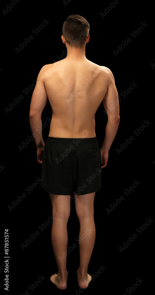 Fototapeta premium Muscle young man on dark background