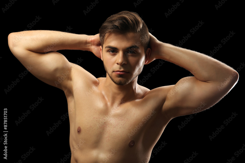 Muscle young man on dark background Muscle young man on dark background