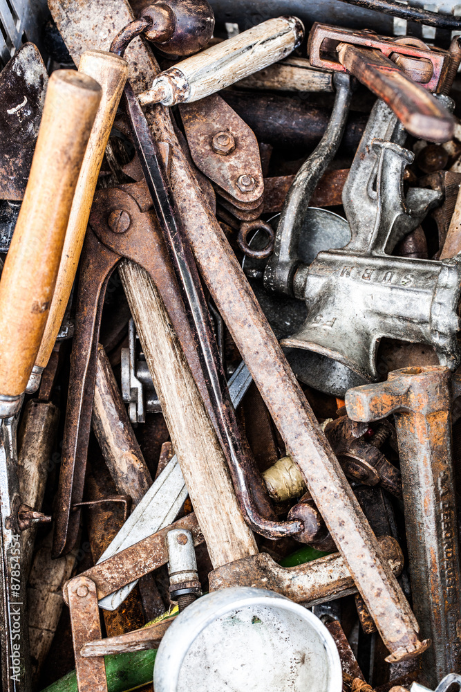 closeup of second hand rusty utensils and accessories of handy man or DIY man for old tool collection or reuse sold at flea market or garage sale for recycling objects closeup of second hand rusty utensils and accessories of handy man or DIY man for old tool collection or reuse sold at flea market or garage sale for recycling objects