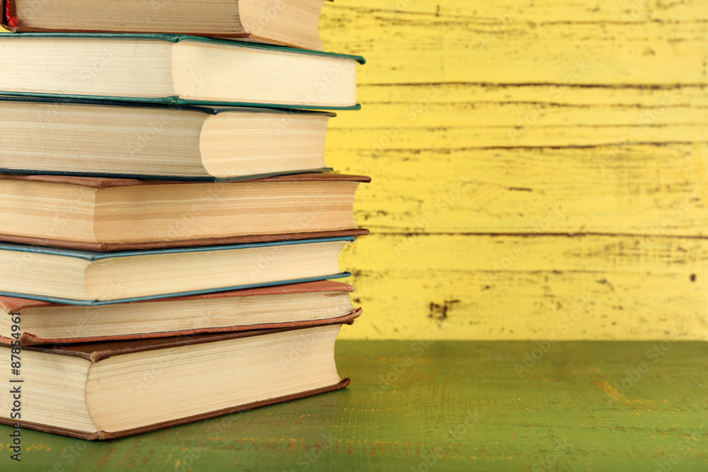 Stack of books on wooden background Stack of books on wooden background
