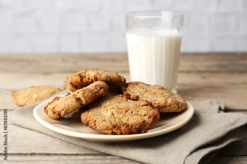 Homemade cookies and glass of milk on table close up Homemade cookies and glass of milk on table close up