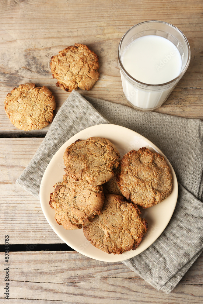 Homemade cookies and glass of milk on table close up Homemade cookies and glass of milk on table close up