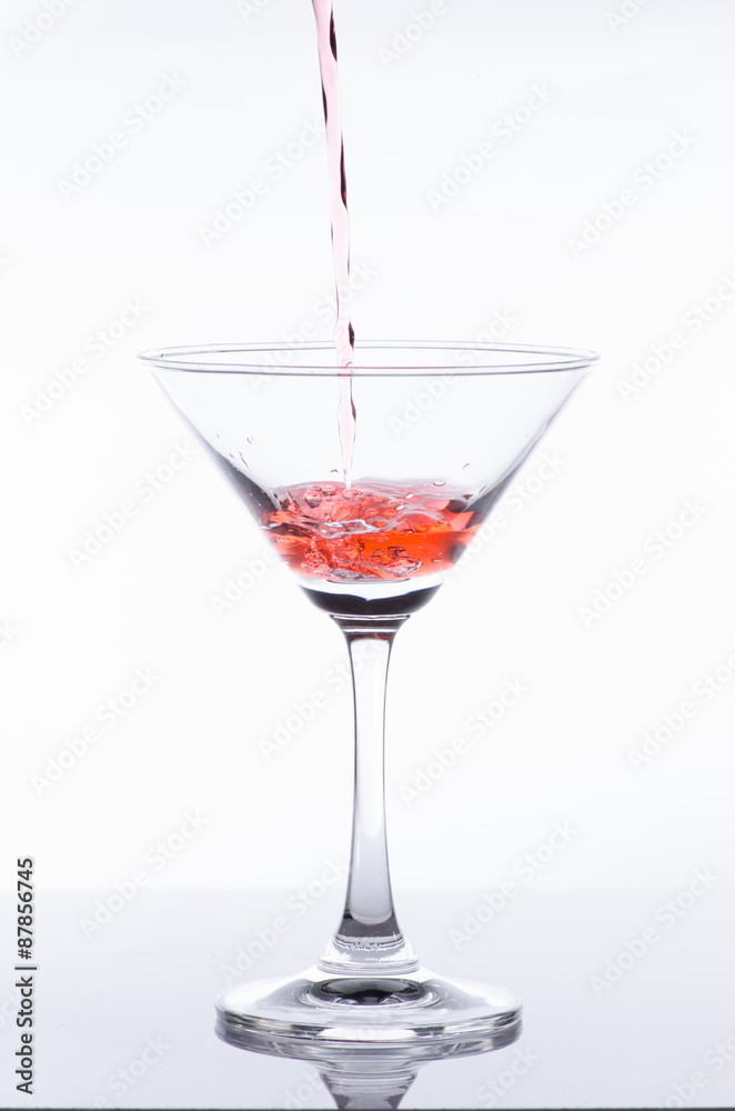orange cocktail in glass isolated on white background orange cocktail in glass isolated on white background