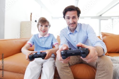 father and son play video game