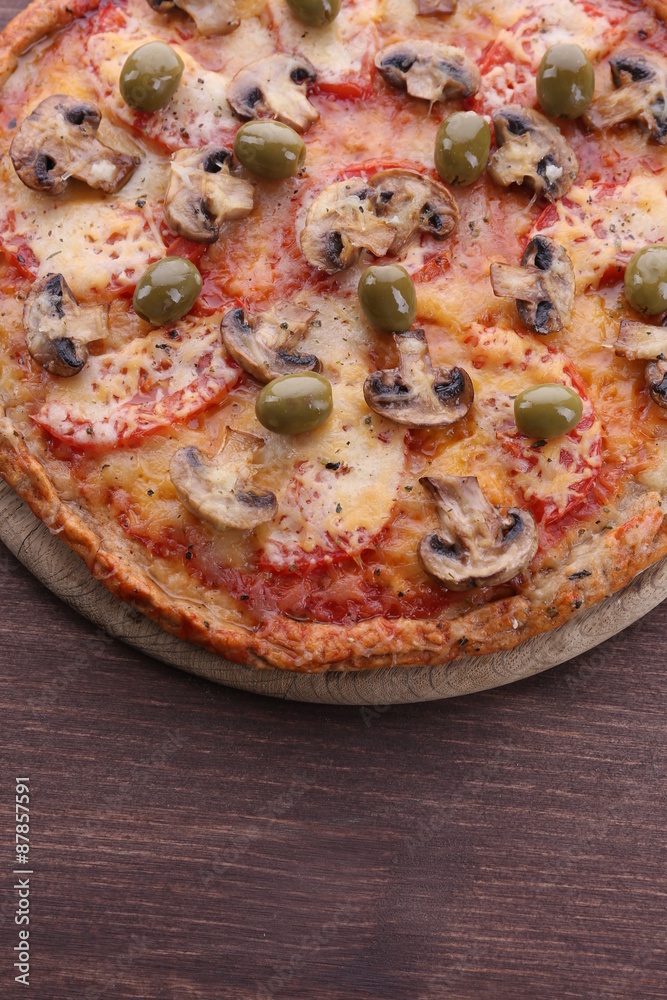 Tasty pizza with vegetables on wooden background Tasty pizza with vegetables on wooden background