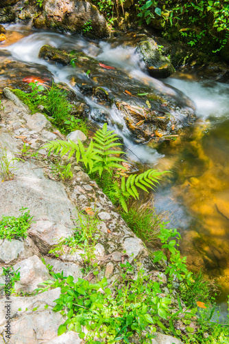 Water Flowing at Mae Kampong Waterfall photo