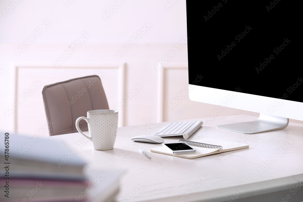 Naklejka premium Workplace with computer in room