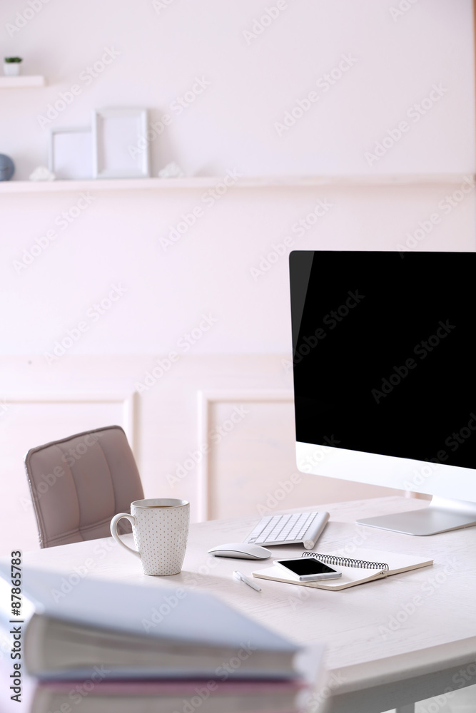Workplace with computer in room Workplace with computer in room