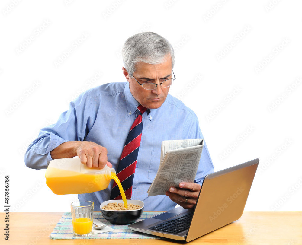 Middle Aged Man Pouring Orange Juice into His Cereal Bowl