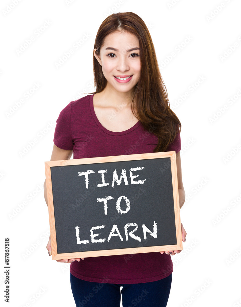 Young woman show with chalkboard phrase time to learn Young woman show with chalkboard phrase time to learn