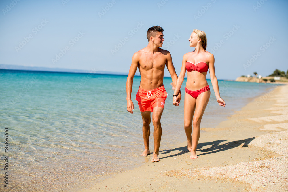 Young couple relaxing on the beach