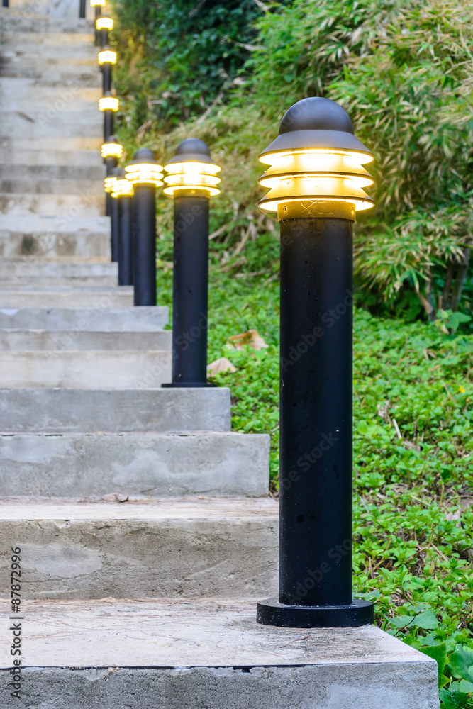 lamp and Stairway up the hillside during Twilight. lamp and Stairway up the hillside during Twilight.