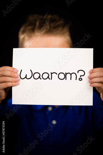 Child holding sign with Dutch word Waarum - Why