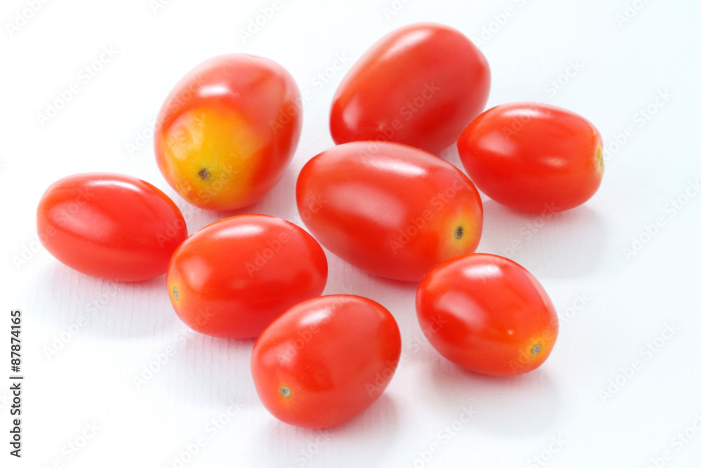 Stack of Roma Tomatoes on white background, macro. It's maybe called Seeda Tomato in Thailand. Stack of Roma Tomatoes on white background, macro. It's maybe called Seeda Tomato in Thailand.