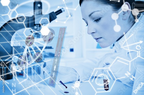 Quadro su tela Composite image of scientist pouring drop of blood