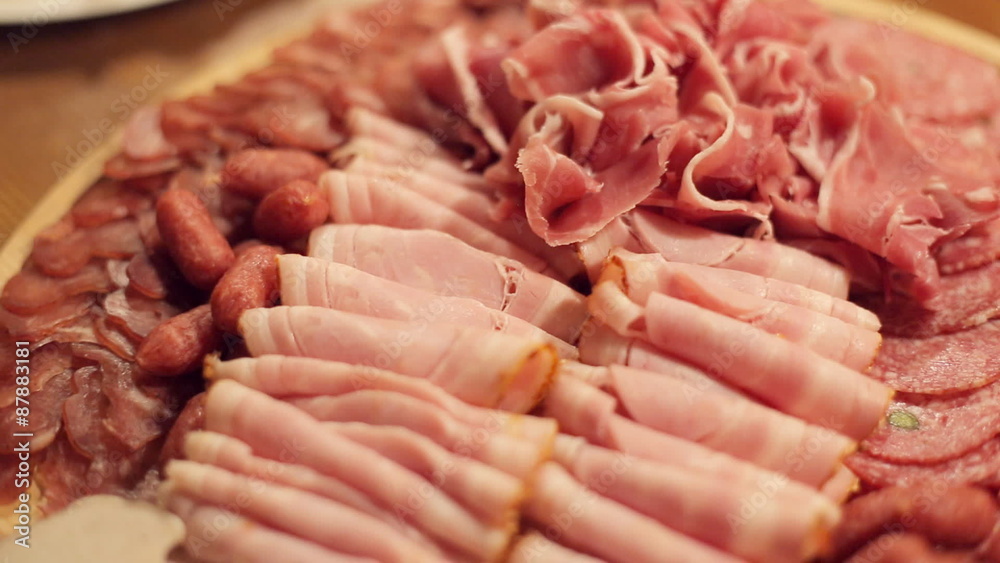 Meat cutting from boiled pork, sausages, smoked meat, sturgeon Meat cutting from boiled pork, sausages, smoked meat, sturgeon