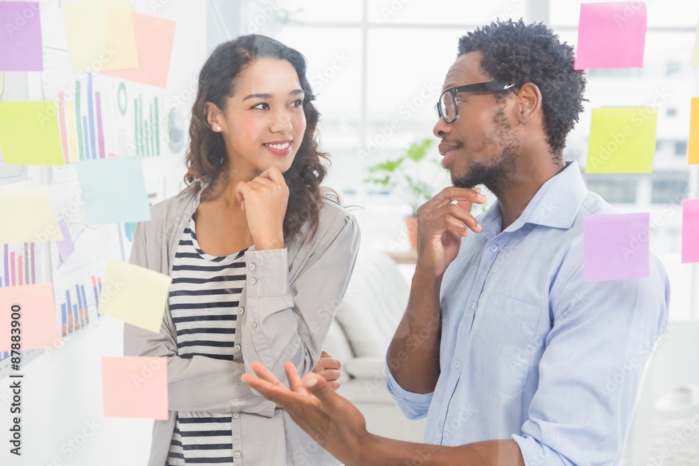 Young creative business people talking to each other Young creative business people talking to each other