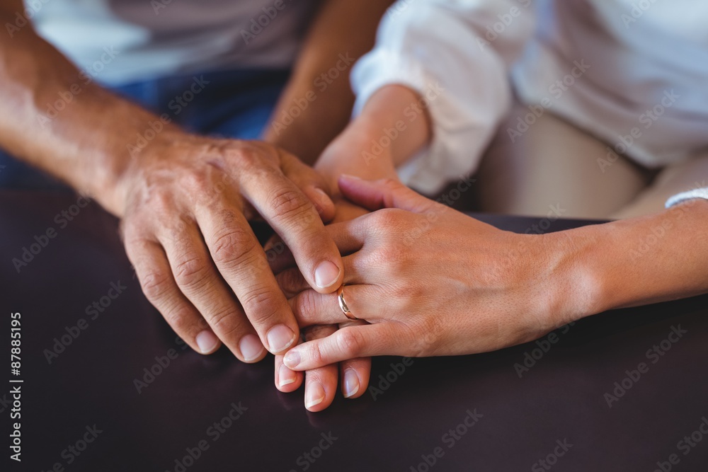Happy couple holding hands Happy couple holding hands