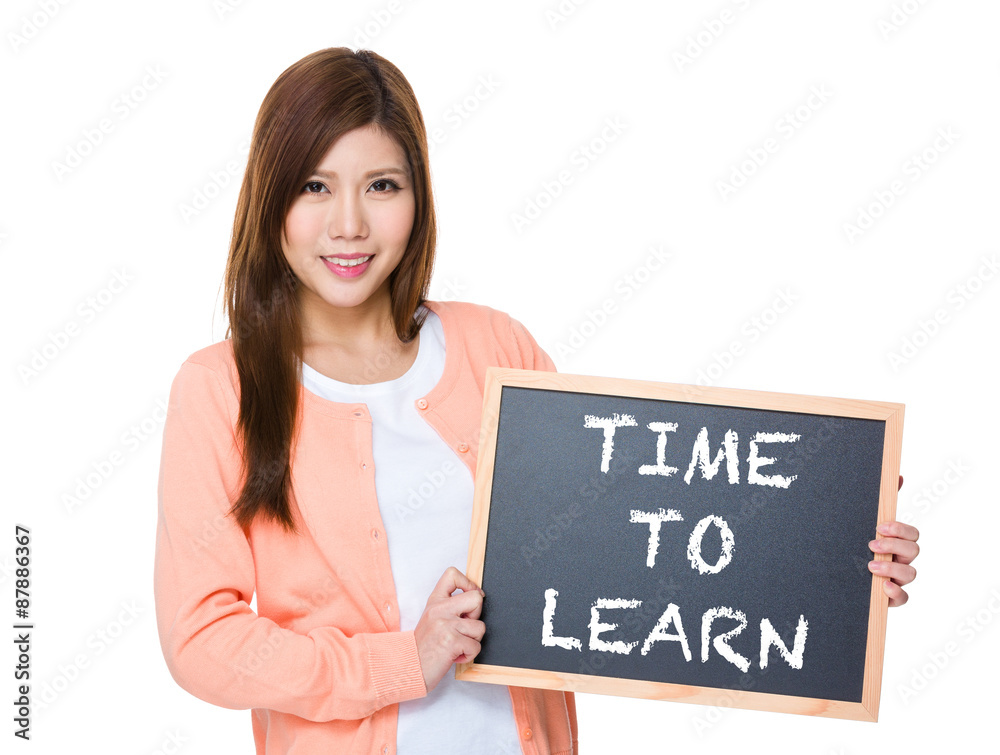 Woman hold with blackboard showing phrase of time to learn Woman hold with blackboard showing phrase of time to learn
