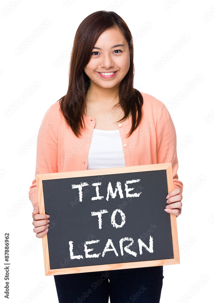Asian woman with black board showing phrase of time to learn Asian woman with black board showing phrase of time to learn