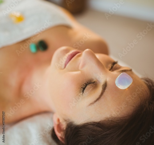 Young woman at crystal healing session photo