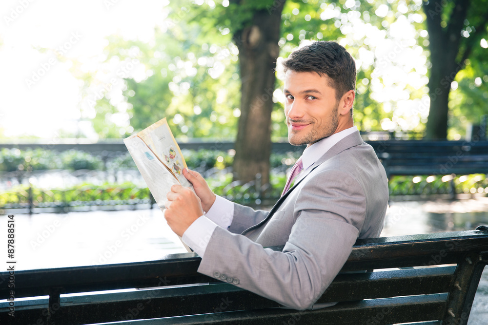 Fototapeta premium Businessman holding newspaper