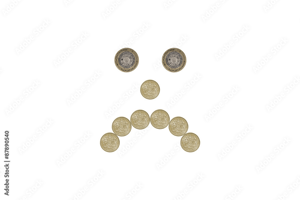 miserable face made out of one pound coins miserable face made out of one pound coins