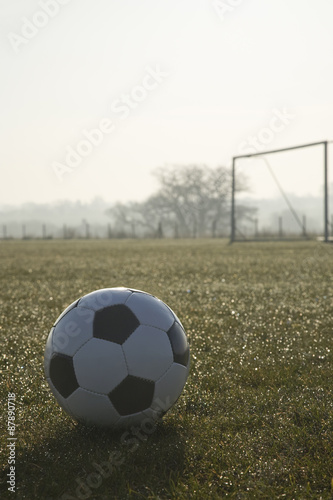 black and white football on a empty football pitch