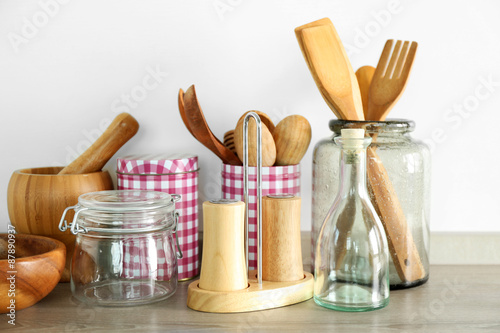 Composition with different utensils on wooden wooden table in kitchen
