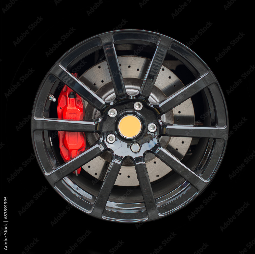 Obraz premium Sports car rim isolated on black background.