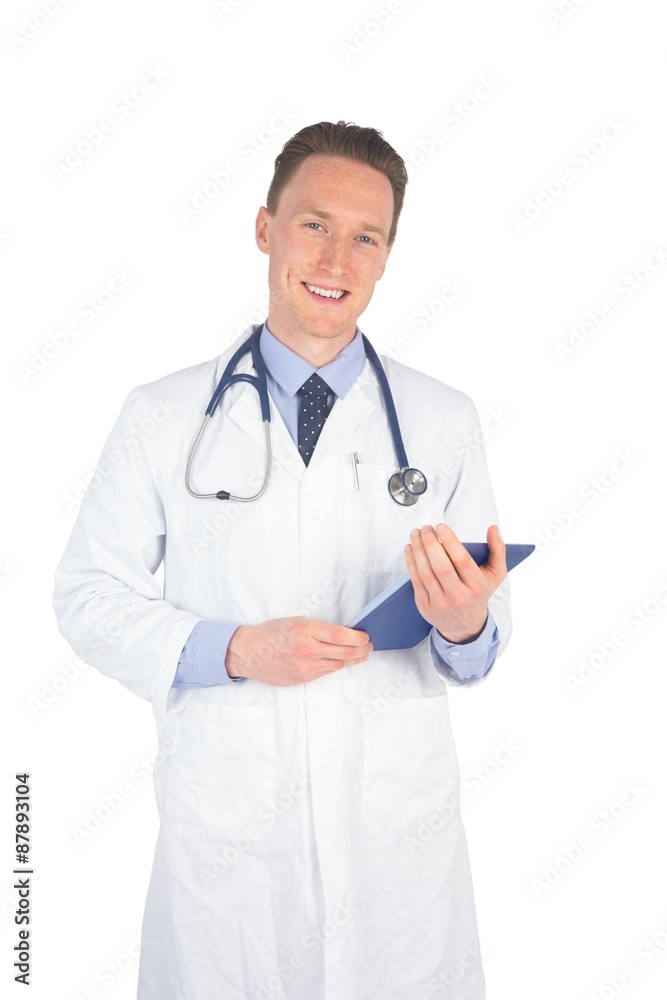 Smiling doctor holding a digital tablet Smiling doctor holding a digital tablet