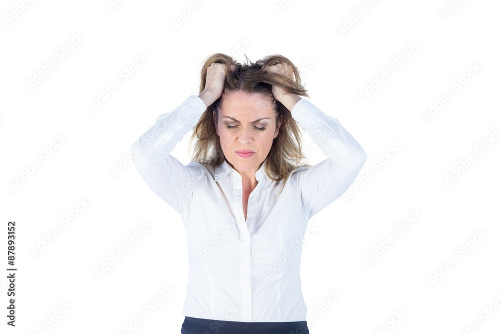 Stressed businesswoman with hands on her head Stressed businesswoman with hands on her head