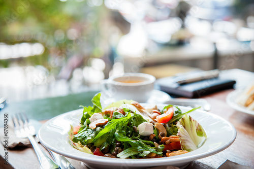 plated salad of vegetables on wooden table 