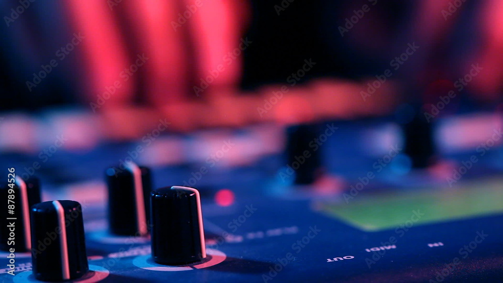 DJ live mixing on synthesizer in night club DJ live mixing on synthesizer in night club