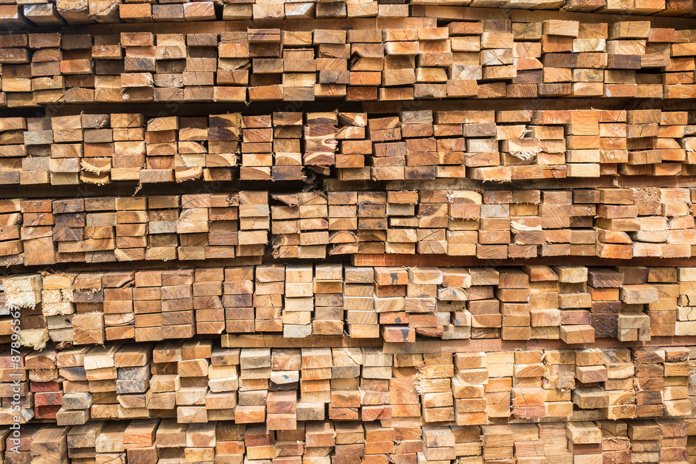 Background of Stacked Wood Cut in Squared Timber Background of Stacked Wood Cut in Squared Timber