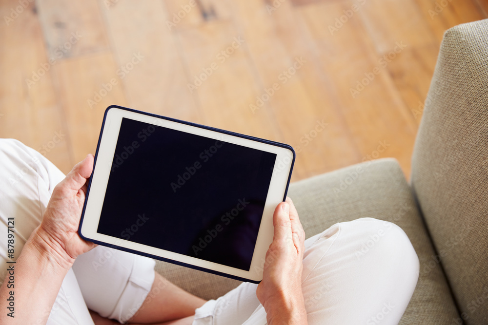 Close Up Of Woman Using Digital Tablet At Home Close Up Of Woman Using Digital Tablet At Home