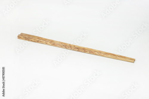 Wooden chopsticks on white background