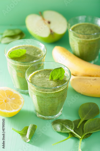 healthy green smoothie with spinach leaves apple lemon banana