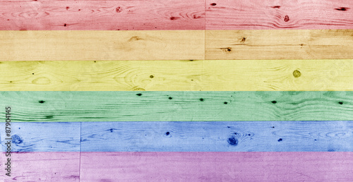 gay pride rainbow flag pattern on wooden surface