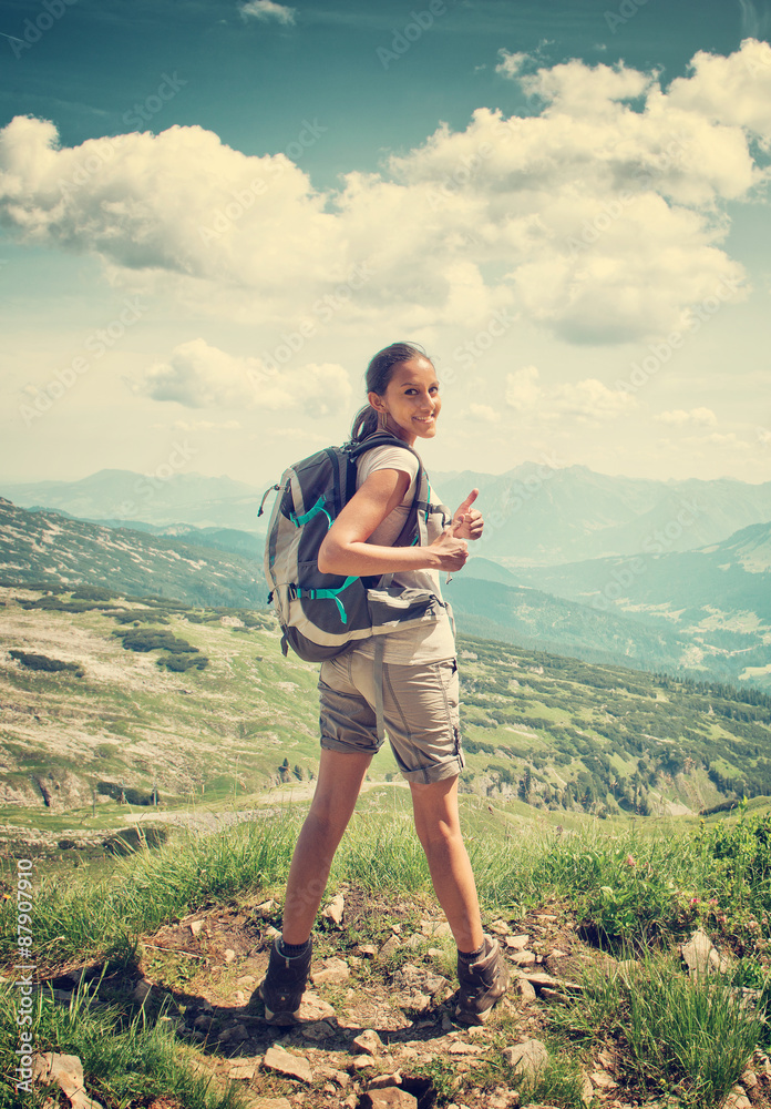 Rear View of Woman Hiking in Mountain Range