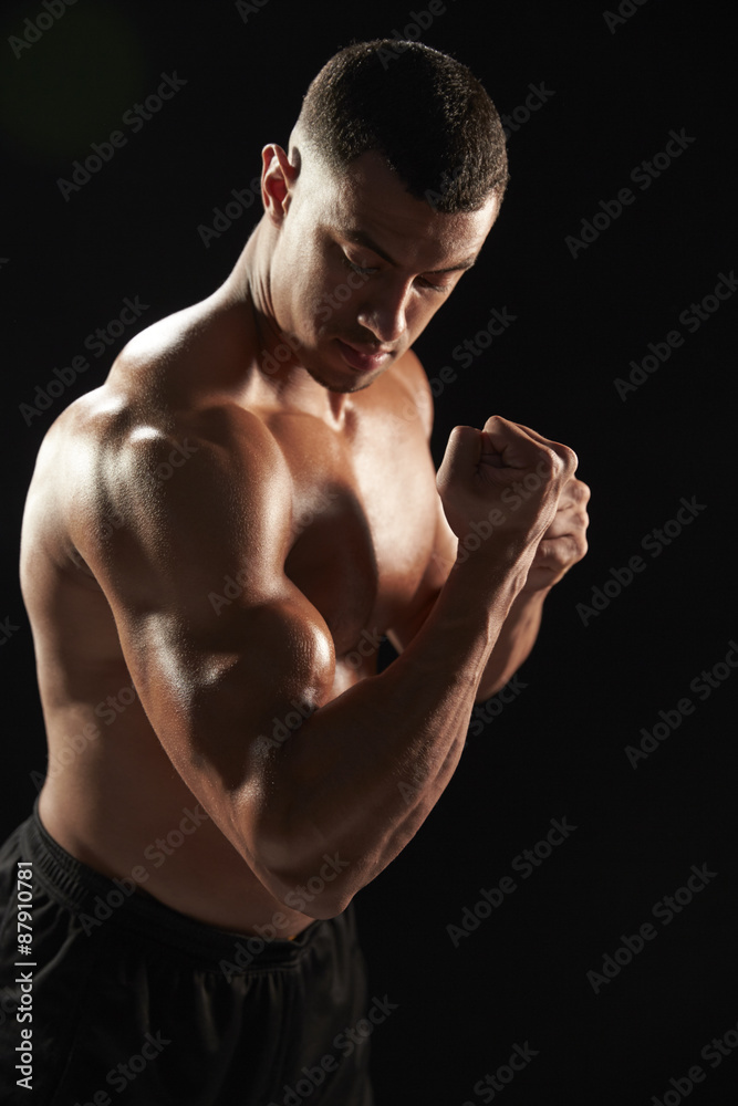 Male bodybuilder flexing muscles Male bodybuilder flexing muscles