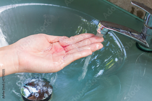 girl washing her hand